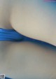 A close up of a woman's butt in a blue bikini.